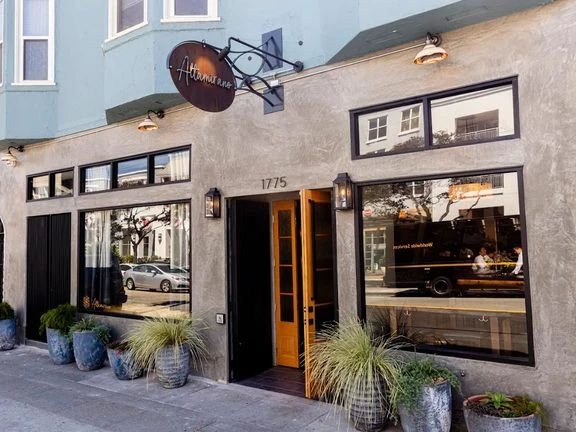 Altamirano Restaurant & Bar storefront on Fulton Street with its wood entry doors open