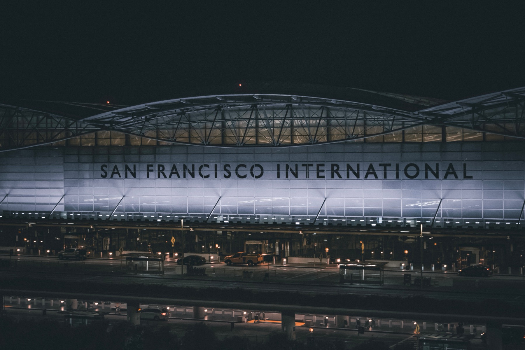 San Francisco International Airport terminal facade lit up at night