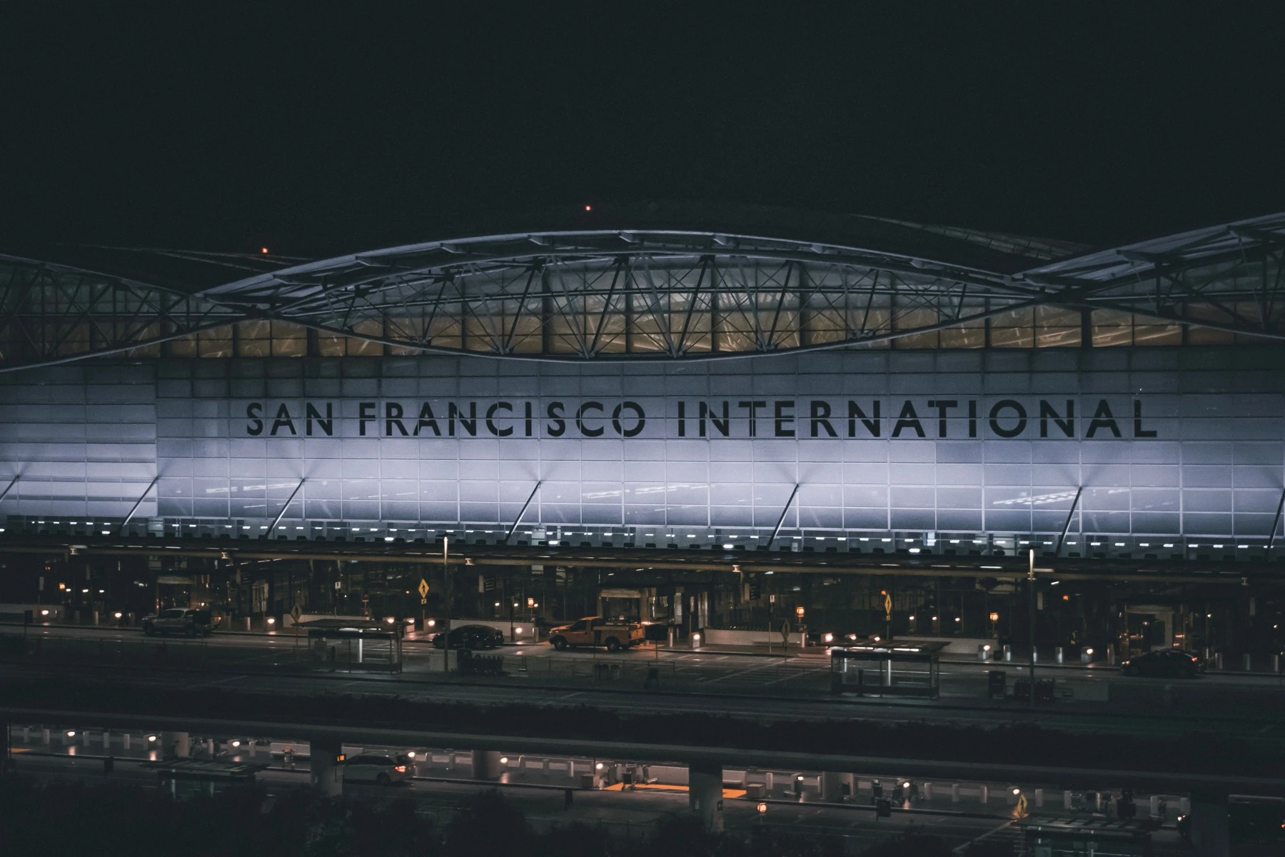 San Francisco International Airport terminal facade lit up at night